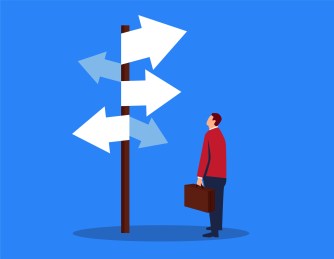 Businessman looking at complicated street sign