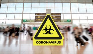 Airport terminal and coronavirus sign